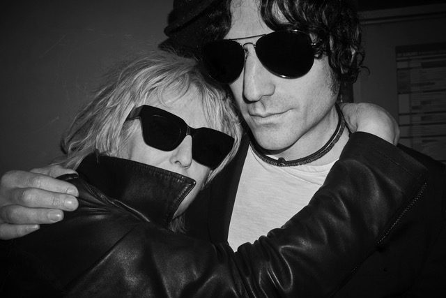 Lucinda Williams and Jesse Malin embrace