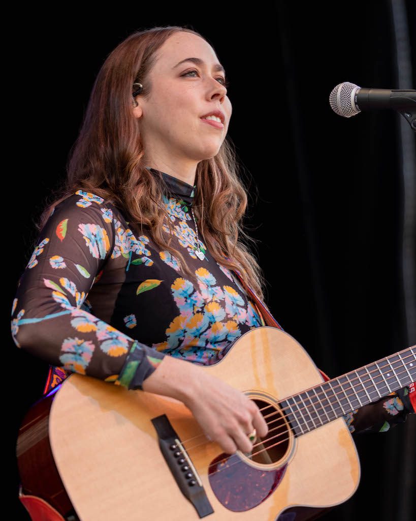 Sarah Jarosz onstage with acoustic guitar