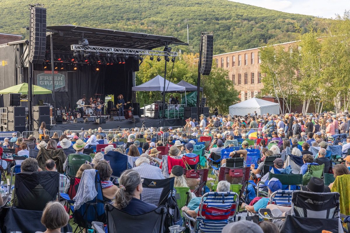 People in lawn chairs in front of the FreshGrass stage in North Adams, Massachusetts