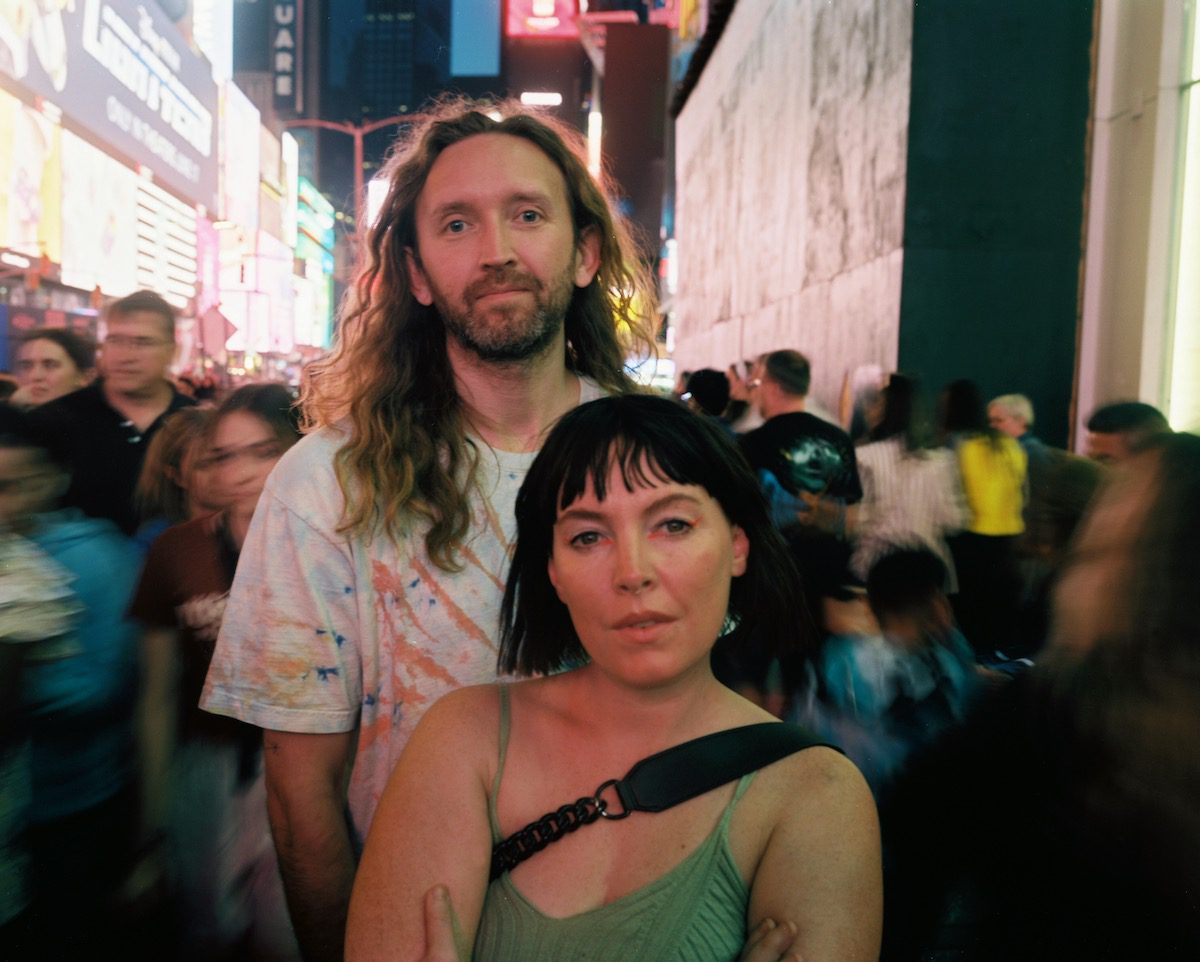 The duo Sylvan Esso in a nighttime city streetscape