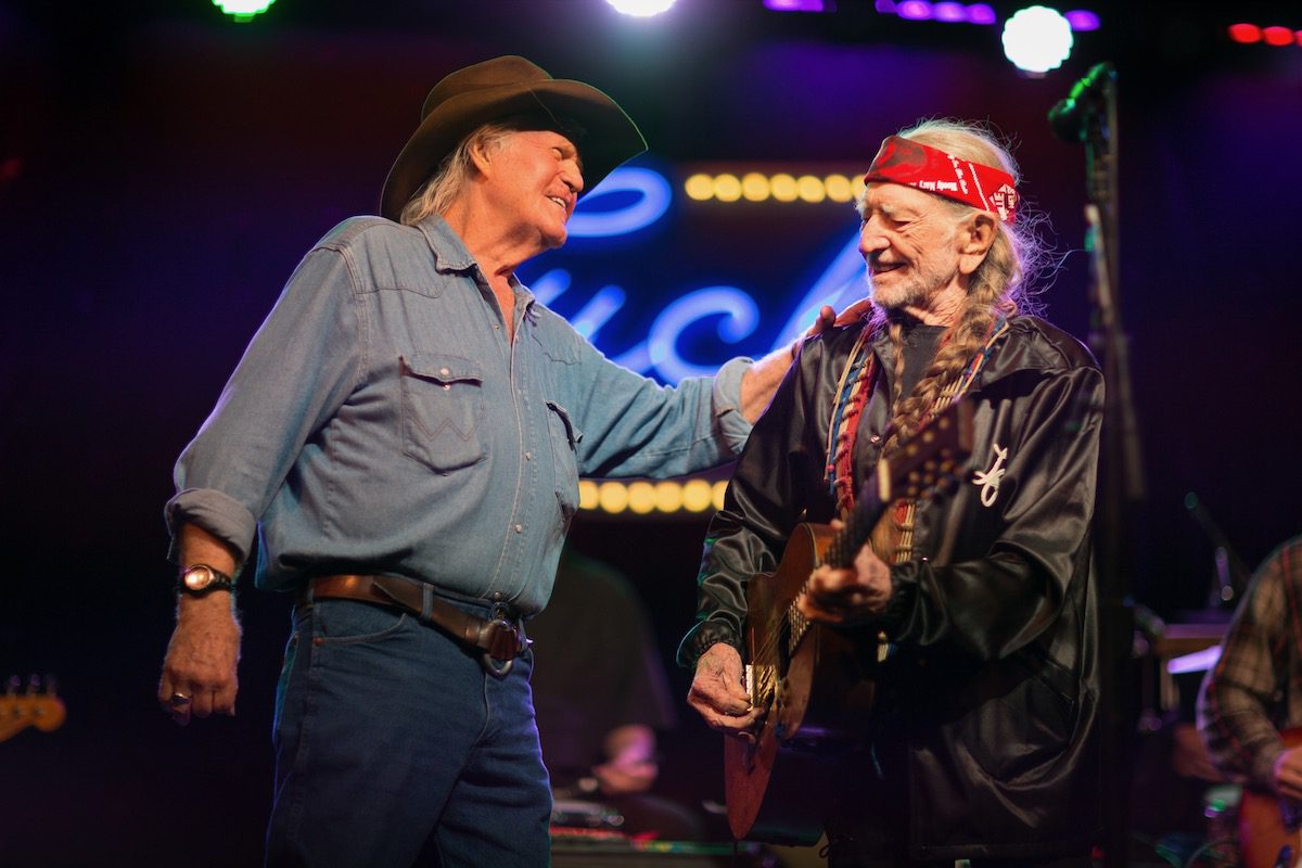 Billy Joe Shaver and Willie Nelson share a friendly moment onstage