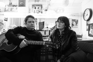 Sean and Sara Watkins of Watkins Family Hour in a backstage dressing room