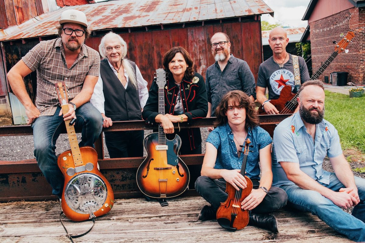 Amy Ray Band photographed outside a red barn