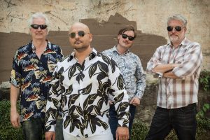 Frank Solivan and Dirty Kitchen in patterned shirts and sunglasses
