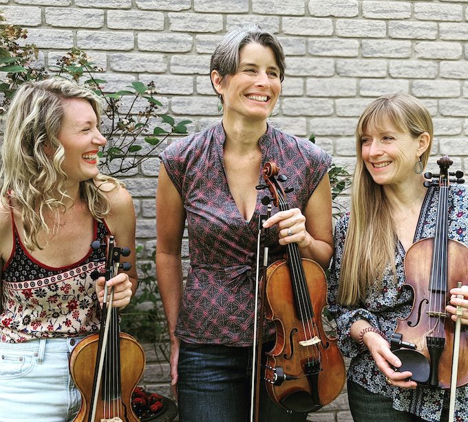 Trio of violinists holding instruments