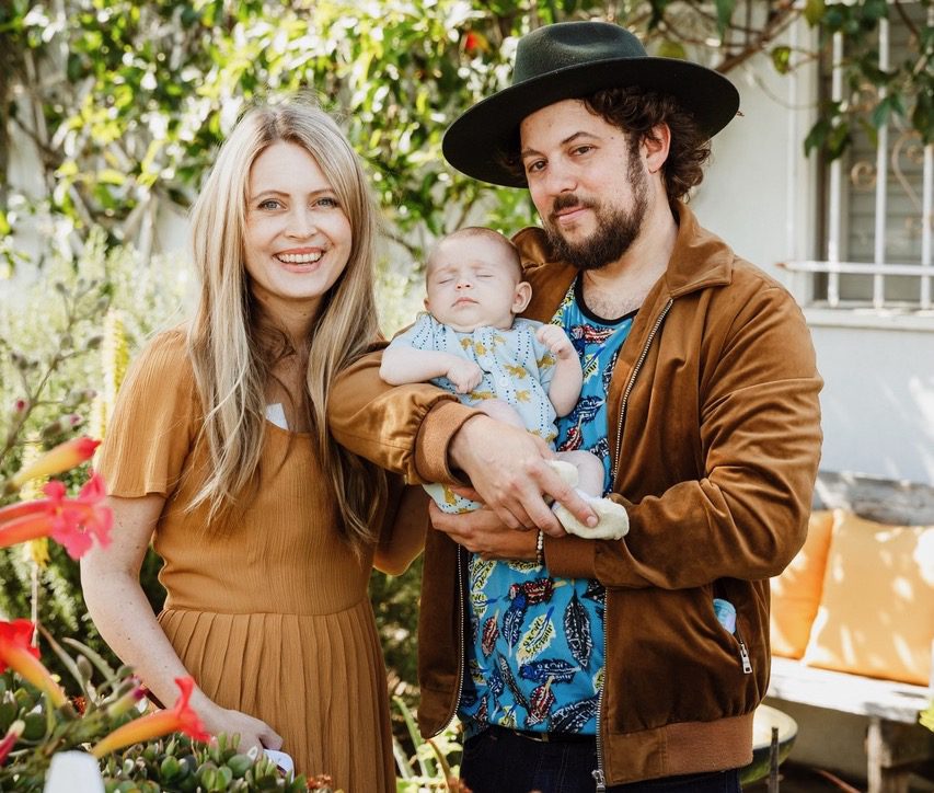 A family portrait of Dustbowl Revival's Z. Lupetin, his wife, Taylor, and their daughter July