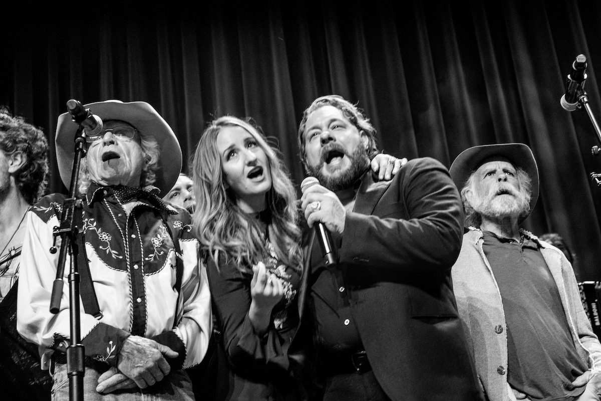 A group of singers onstage at the Ryman Auditorium