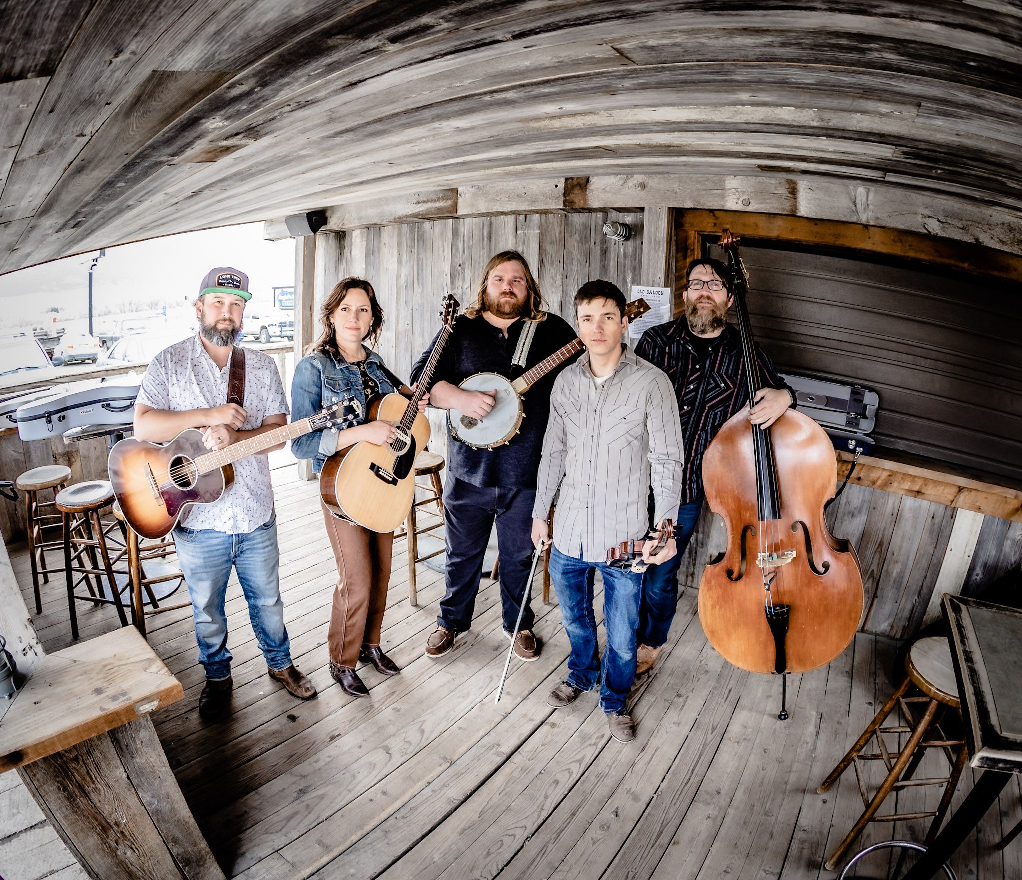 Group photo of Laney Lou and the Bird Dogs on a barn-like porch