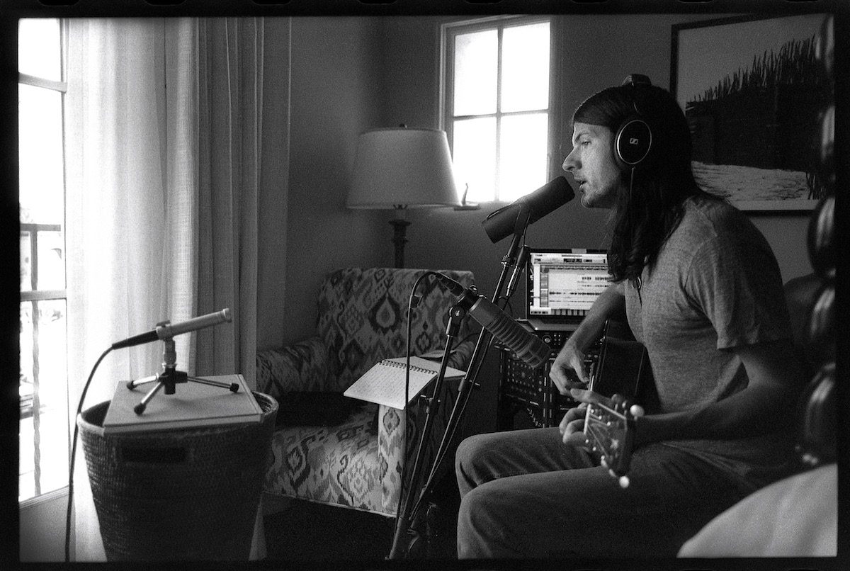 Seth Avett with recording gear in a hotel room