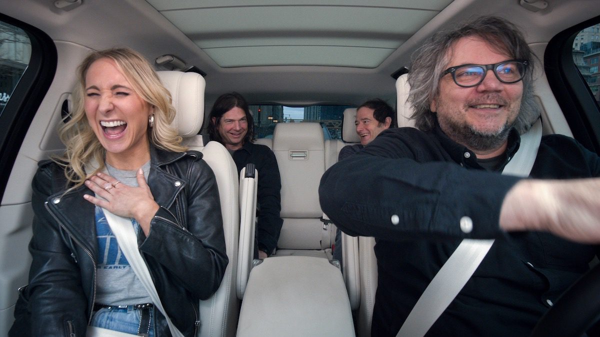 Nikki Glaser and Wilco inside a car