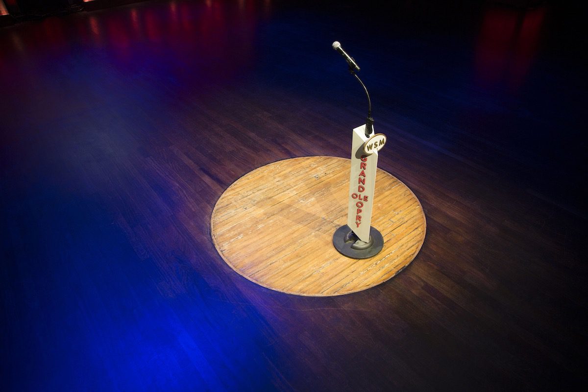 A circle of wood and a microphone on the stage of the Grand Ole Opry