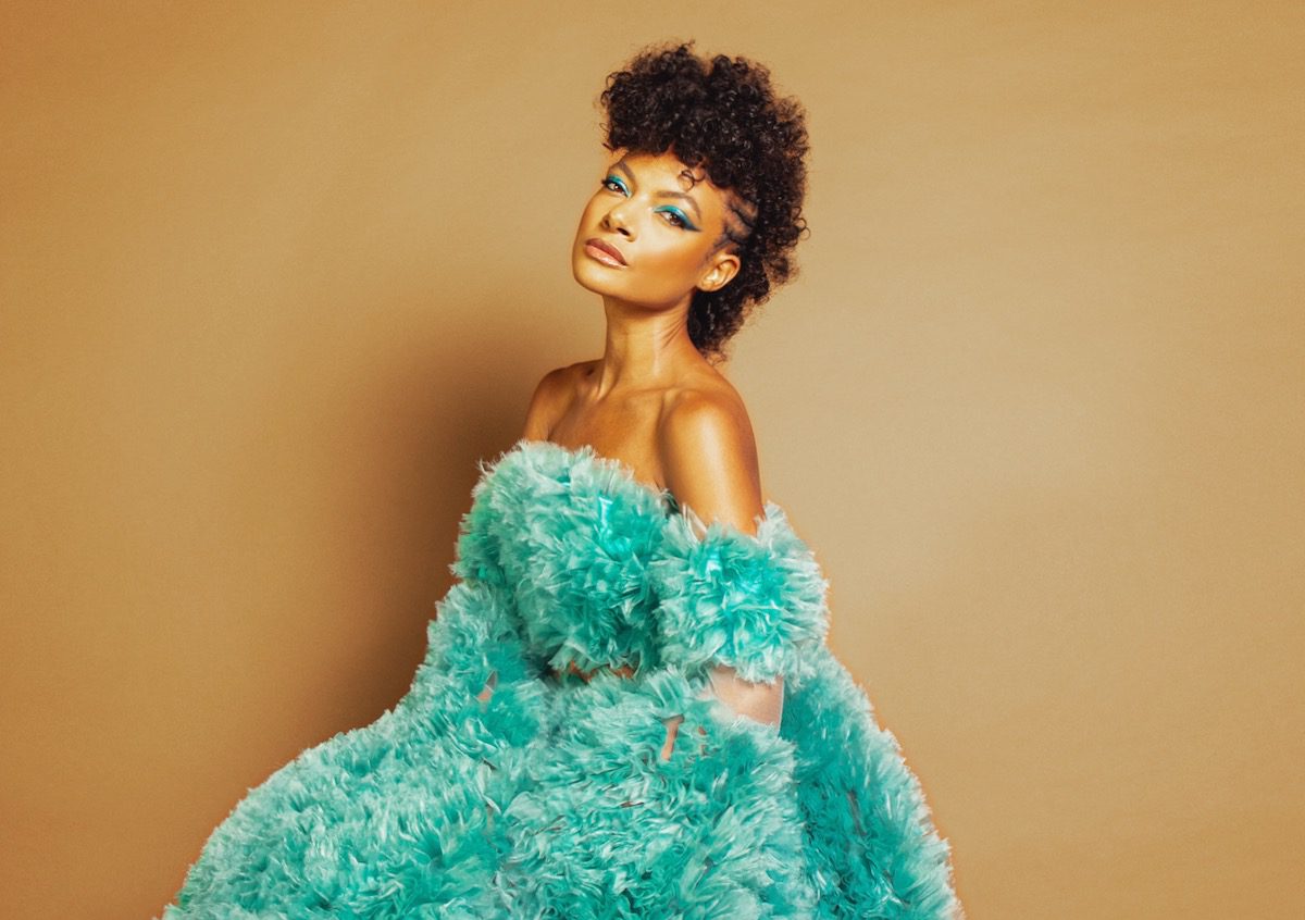 Allison Russell wearing aqua fuzzy gown