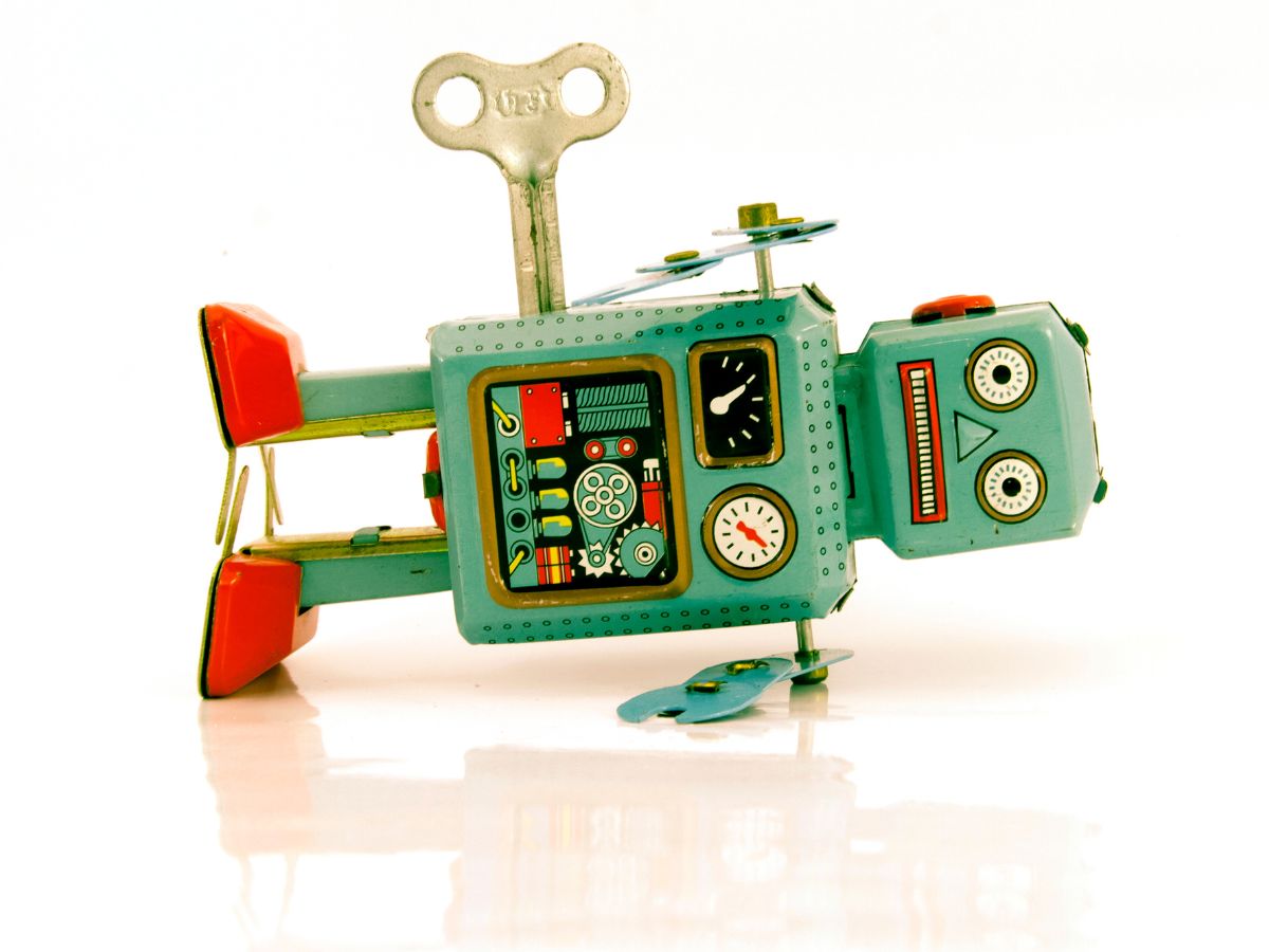 A tin robot toy fallen on its side