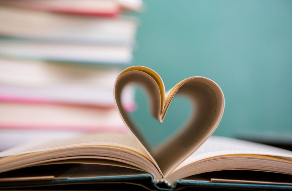 A book with pages bent into a heart shape