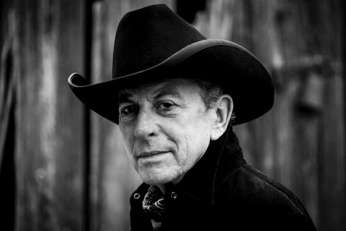 black and white portrait of Joe Ely in dark cowboy hat